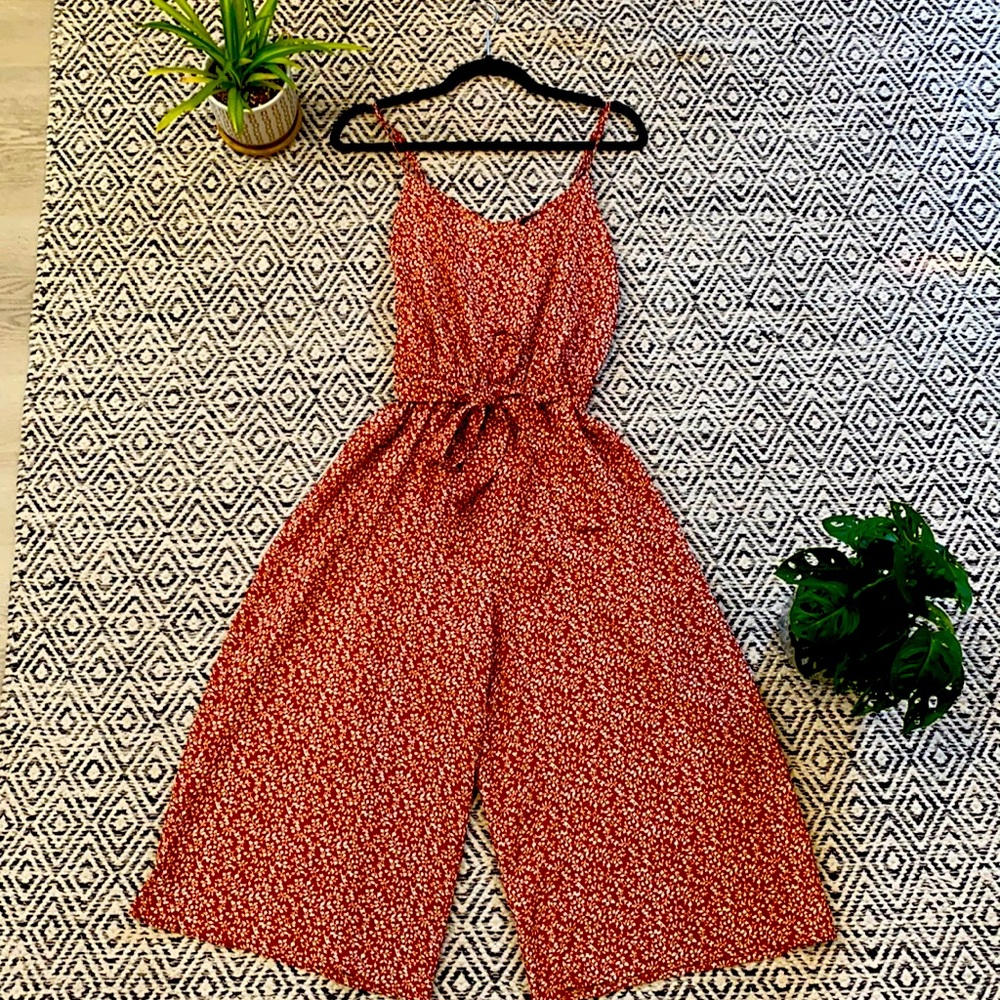 Cute burnt orange, floral jumpsuit, gently used